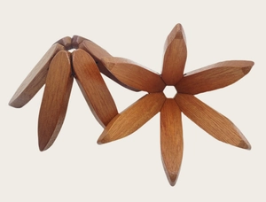 Macro detail of foldable star-shaped wooden heat insulation pads in two states