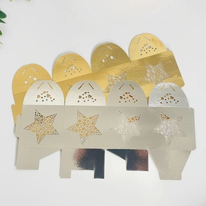 Flat lay of laser-cut star and heart candy boxes in gold and silver metallic finish