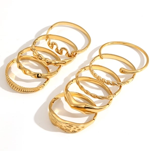 Assorted gold geometric textured stainless steel bracelets with various stylish patterns