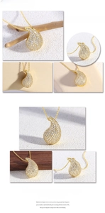Macro detail of teardrop pendant necklace with sparkling pavé cubic zirconia and gold plating