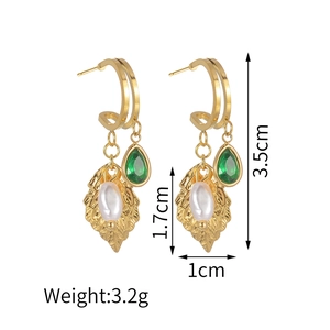 Detail showing dimensions of gold leaf earrings with green gems and faux pearls