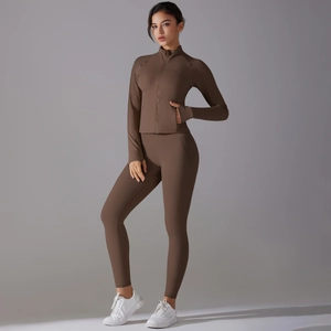 Close-up of brown yoga set featuring high-waist leggings and slim zip-up sports jacket