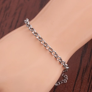Detail of adjustable silver titanium steel chain bracelet shown on a wrist display