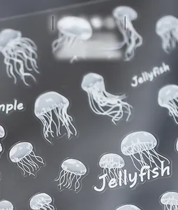 Detail shot of white ink jellyfish nail stickers with matte finish on transparent film
