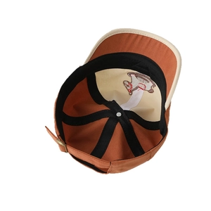 Interior view of kids embroidered pony baseball cap with adjustable metal buckle and contrast color