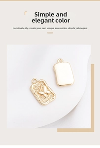 Macro shot of 14K gold-filled rectangular pendants featuring a detailed butterfly relief