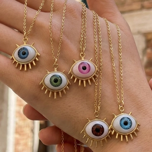 Detailed shot of 18K gold plated Evil Eye necklaces in five vibrant pupil colors