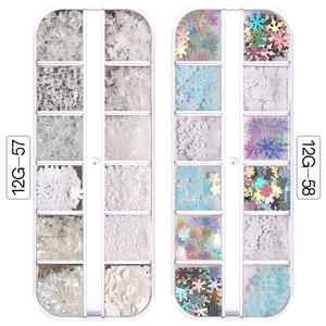 Detail of Christmas nail art glitter set with snowflakes and sequins in storage cases
