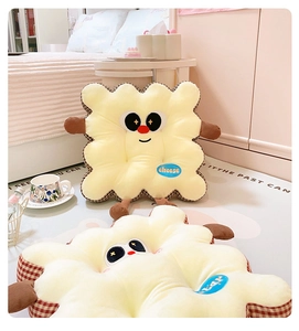 Close-up of cute cartoon biscuit cushion with plush texture and cheese embroidery