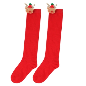 Detail of red Christmas stockings for kids with cute 3D reindeer doll attachment