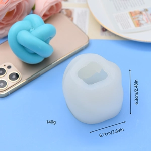 Blue 3D geometric knot aromatherapy candle and white silicone mold for DIY crafts