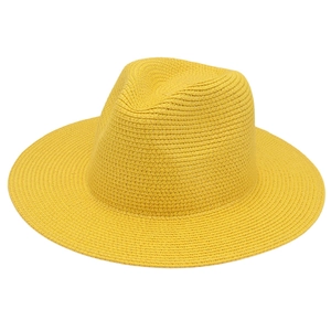 Detailed close-up of the fine weave texture on a vibrant yellow Panama straw hat
