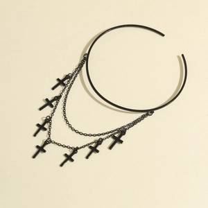 Detail of a gothic black choker featuring a double chain with seven cross pendants