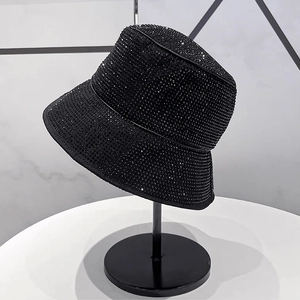 Detailed close-up of a luxury black disco bucket hat covered in sparkling rhinestones