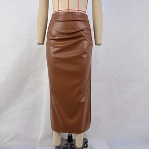 Detailed view of high-waist brown PU leather midi skirt with side ruched pleat design