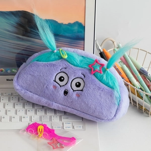 Detail of purple plush pencil case with embroidery cartoon face and fun blue fiber hair
