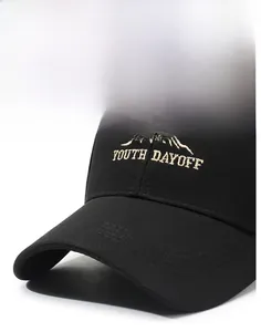 Close-up of beige mountain embroidery and YOUTH DAYOFF text on a black baseball cap