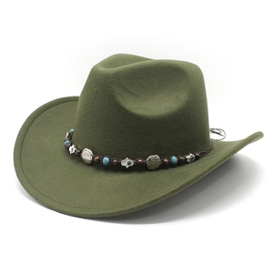 Detail of dark green felt cowboy hat featuring ethnic beads and silver sun pendants