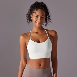 Detail of white yoga bra with wide hem support and high-elastic brushed fabric