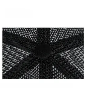Close-up of black breathable mesh stitching and reinforced top button on a baseball cap