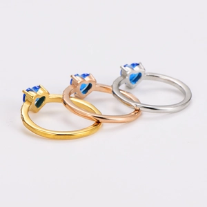 Elegant stainless steel ring with a blue heart-shaped cubic zirconia in three finishes
