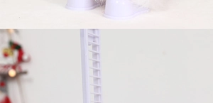 Detailed view of the purple plastic base and white ladder of the electric Santa toy