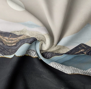 Macro view showing abstract mountain print fabric texture with gold lines and soft draping