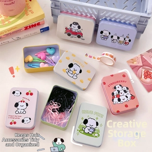 Close-up of pastel macaron-colored tin boxes with cute cartoon dog patterns
