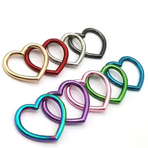 DIY heart-shaped alloy spring buckle rings in nine metallic plated colors on white background