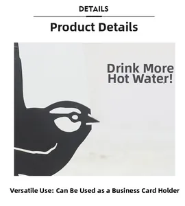 Close-up detail of a black metal bird silhouette clip used for photos and business cards