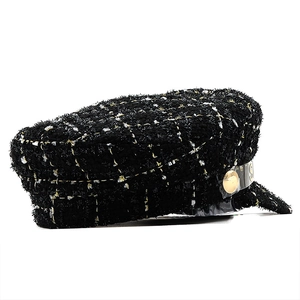 Classic black and gold tweed baker boy hat with metallic threads and decorative button
