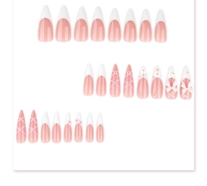 Detail of long pointed press-on nails with pink bows, pearls and floral 3D art