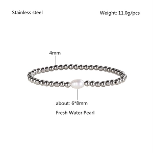 Detail of 4mm stainless steel beads with a 6x8mm freshwater pearl on elastic bracelet
