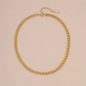 Detail view of gold layered interlocking curb chain necklace with lobster clasp