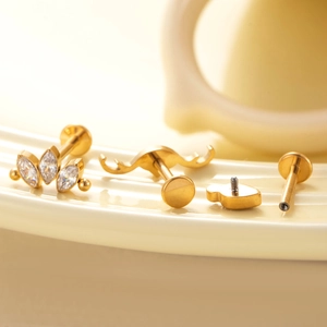 Titanium piercing jewelry set with golden finish and triple marquise zircon stones