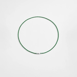 Detail view of S925 sterling silver tennis necklace with vibrant green zircon stones
