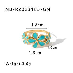 Detailed view of gold 18k plated daisy ring with blue enamel flowers and size markings