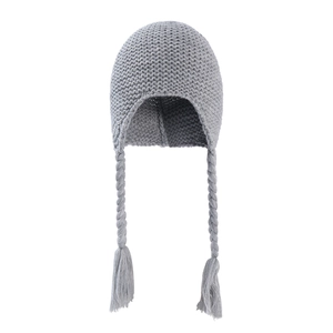 Close-up of grey knit baby hat showing thick texture and braided earflap tassels