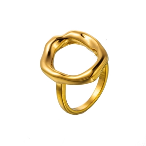 Detailed macro shot of a chunky gold irregular geometric stainless steel ring