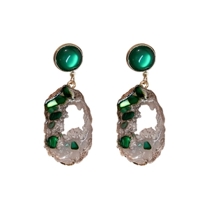 Irregular hollow green emerald resin drop earrings with golden metal frames in vintage style