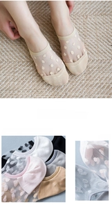 Detailed view of mesh invisible boat socks with cute heart patterns in multiple colors