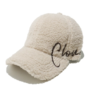 Detailed close-up of soft lamb wool texture and Cloud embroidery on the baseball cap