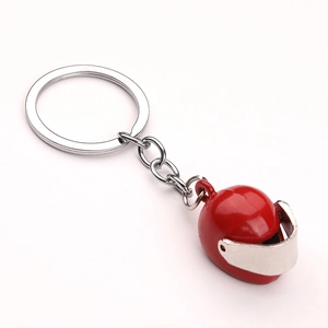 Detailed view of creative red motorcycle helmet keychain with silver metal visor and ring