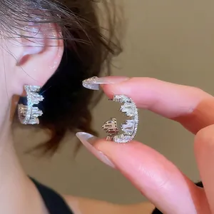 Sparkling S925 silver C-shaped hoop earrings with irregular zircon stones for women