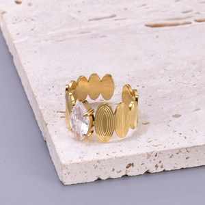 Detailed close-up of 18K gold-plated oval ring featuring a marquise-cut clear gemstone