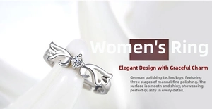 Detailed macro view of adjustable silver ring with angel wing design and round cut stone