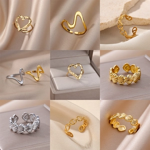 Set of gold and silver stainless steel open rings with celestial and geometric patterns