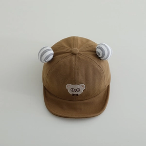 Close-up of soft-brim baby baseball cap with bear embroidery and stripe 3D ears detail