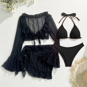 Flat lay of black 4-piece lace bikini set with long sleeve cardigan and mini skirt