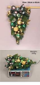Christmas teardrop swag with green ribbons and gold ornaments measuring 30cm by 45cm
